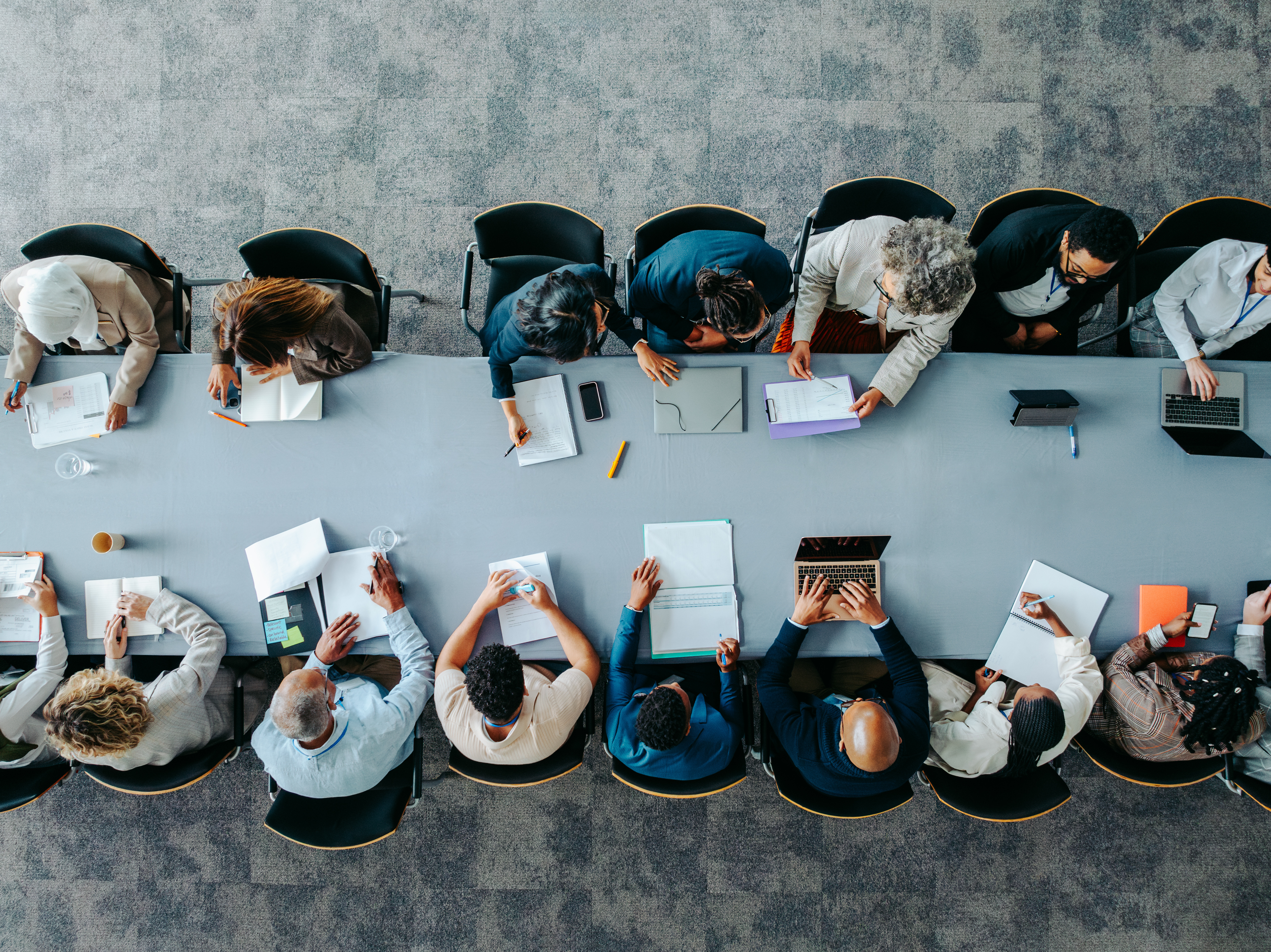 Diverse leadership team working together at a large conference table